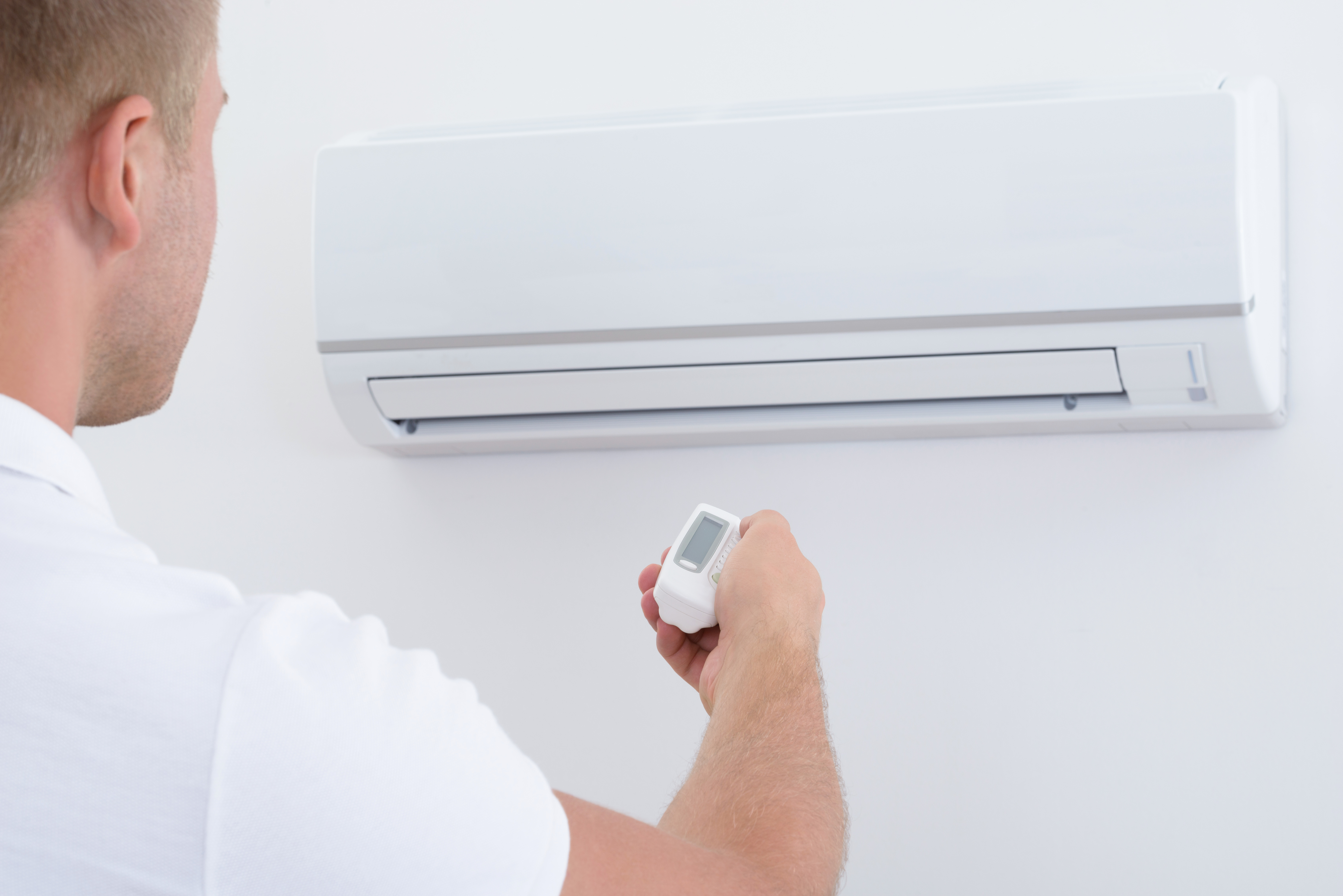 professional-heat-pump-service-paraparaumu-electrician-cleaning-outdoor-unit-coastal-property